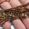 Купить (ОПТ) Бусина округлая "каменный бисер" 2мм  Тигровый глаз (камни) (НИТЬ) с доставкой по России