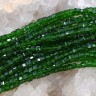 Купить (ОПТ) Бусина кристалл гранёный Кубик 2,5*2,5*2мм т.зелёный прозрачный (имитация Сваровски) (НИТЬ) с доставкой по России