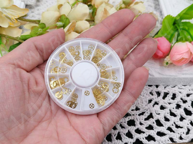 Наполнение для смолы и бутылочек 050 фигурки Шестерёнки микс 4-6*0,1мм золотистые в контейнере (декор)