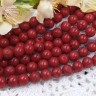 Купить (ОПТ) Бусина округлая 10мм Коралл НАТУРАЛЬНЫЙ т.красный (камни) (НИТЬ) с доставкой по России