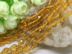 Бусина Капля гранёная 02 12*8*8мм т.золотистая прозрачная (имитация Сваровски)