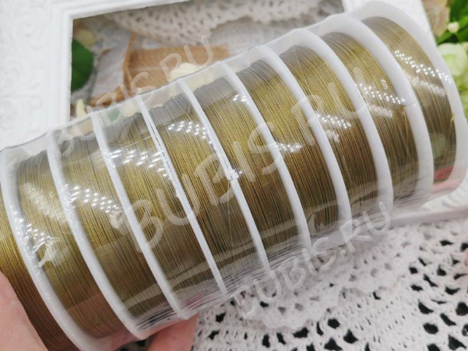 (СКИДКИ!!!) Катушка Ланки №09 0,3мм зеленовато-золотистая (ок.100м)