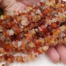 Купить Крошка (галтовка) каменная 016 5-9мм Карнелиан (Сердолик) натуральный (камни) (нить 43-45см) с доставкой по России