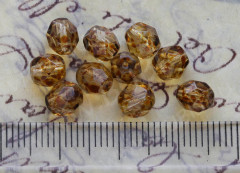 Овальные гранёные бусины 6*5мм золотистые с коричневыми разводами прозрачные (стекло) (10шт.)