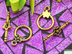 097 Тоггл округлый с Цветочком 20,5*14мм и 26*7мм античное золото (литьё)